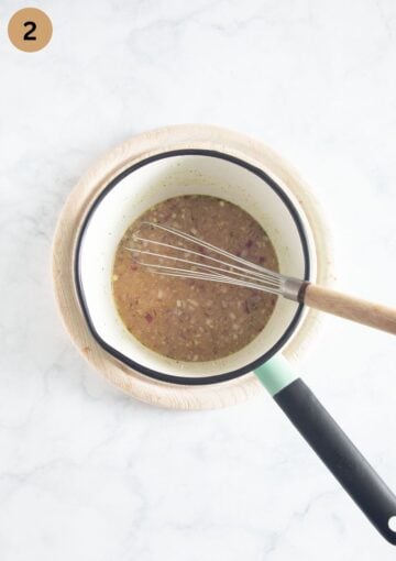 mixing finely chopped onions with stock and mustard to make potato salad dressing.
