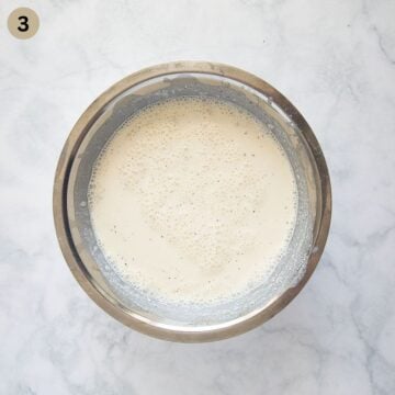 cream cheese, milk, and garlic in a bowl needed to make pasta sauce.