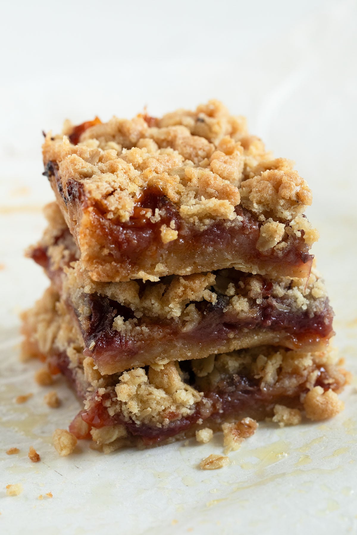 three pieces of peach crumble bars stapled on the table.