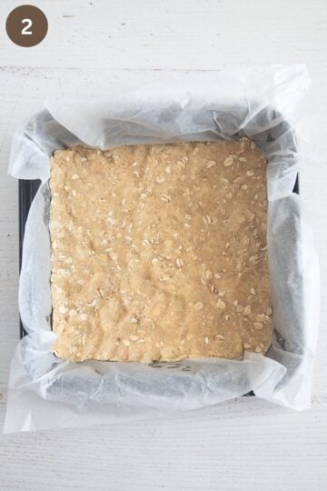 the base for crumble bars pressed into a line baking dish.