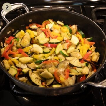 sauteing vegetables in a pan for making ratatouille.