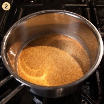 mixing evaporated milk, dip and seasoning for making beer cheese dip in a small saucepan.