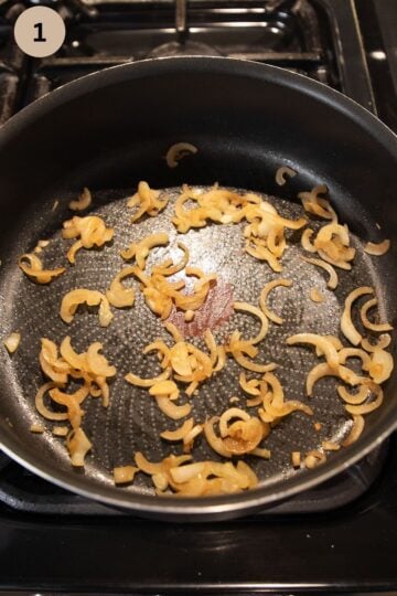 cooking onions for sauerkraut in a skillet.